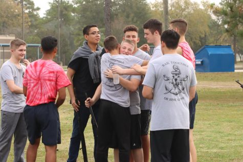 YOU GOT A FRIEND IN ME: Armed Drill Team sharing a group hug before they have to get ready to perform.