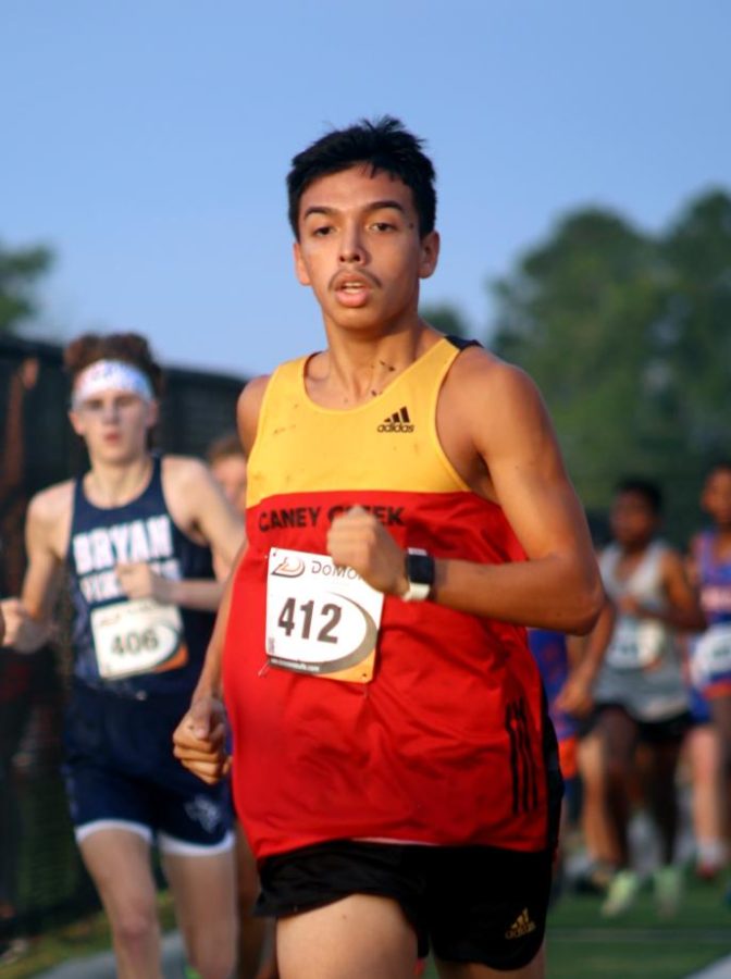 Senior Alex Castillo competes at the Grizzly Invitational at Grand Oaks on September. 3. 2022. The boy Cross Country team placed seventh beating Conroe High and Willis. we felt confident going into the race and it felt good Beating Conroe but we know we still have to keep working to make sure we beat them in our upcoming races. Castillo said. Beating these teams who are their rivals is a big accomplishment for the team.