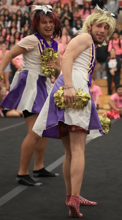Senior Cameron Mayon and others dress as a Willis high school cheerleaders while performing a skit for the pink out pep rally on October 14, 2022. It felt amazing to give the school something to laugh at, Mayon said. I always loved being in front of crowds and giving them something to react to.