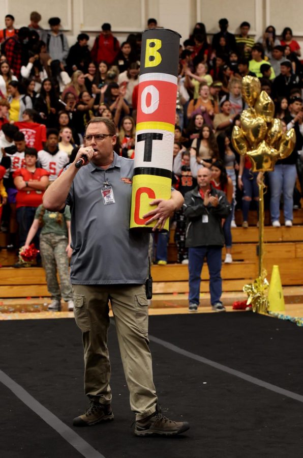 LET’S BE LOUD. Principal Dr.Sticler is on a microphone on Oct.28,2022. Sticler announces the winner to the battle of the classes. 