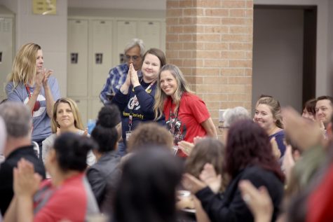 Campus faculty and staff applaud English Department Chair Christine Zimmer for being named Conroe ISD Secondary Teacher of the Year at a faculty meeting at 9 a.m. Friday, May 5 a day after evacuating the building due to a mysterious odor.