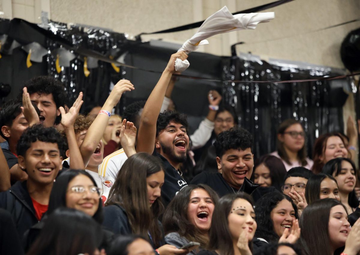 LETSS GOOO.  Senior Edgar Barrientos swings his soccer jersey for the senior chant for Sep. 15, 2023 battle of the classes. The boys soccer team stays together during pep rally chants to help the senior class get the spirit stick.