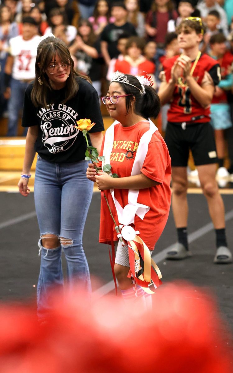 HER MAJESTY. Coral Dominguez crowned homecoming queen for the life skills students by senior Jayden Hodkinson on Sep. 15, 2023 at Caney Creek High School. The idea to separately crown a life skill homecoming king and queen was inspired by Mrs. Underwood and Senior Bailey Johnson. 
