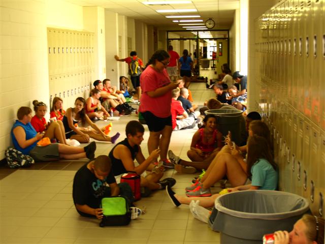 The marching band takes a lunch break during summer band camp in between preparing for the months ahead. 
