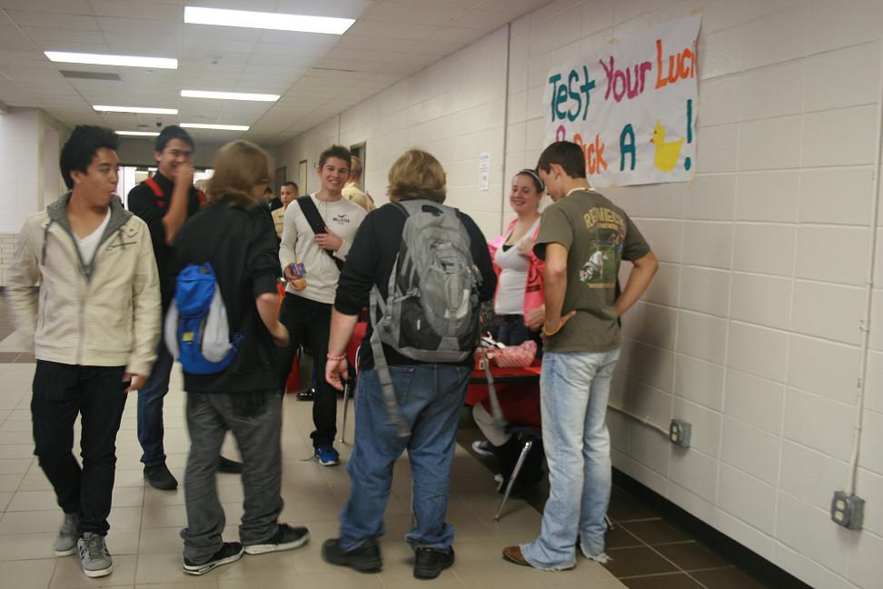 Students line up to pick duck and test their luck in the cafeteria on October 23.