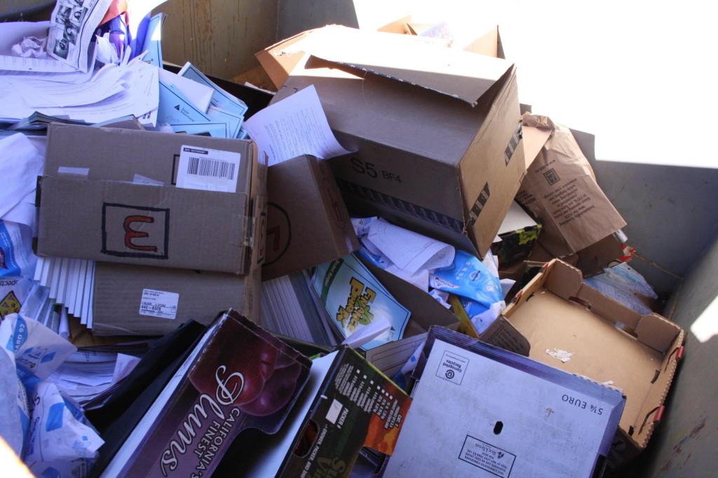 These dumpsters full of paper made products are waiting to be recycled. 