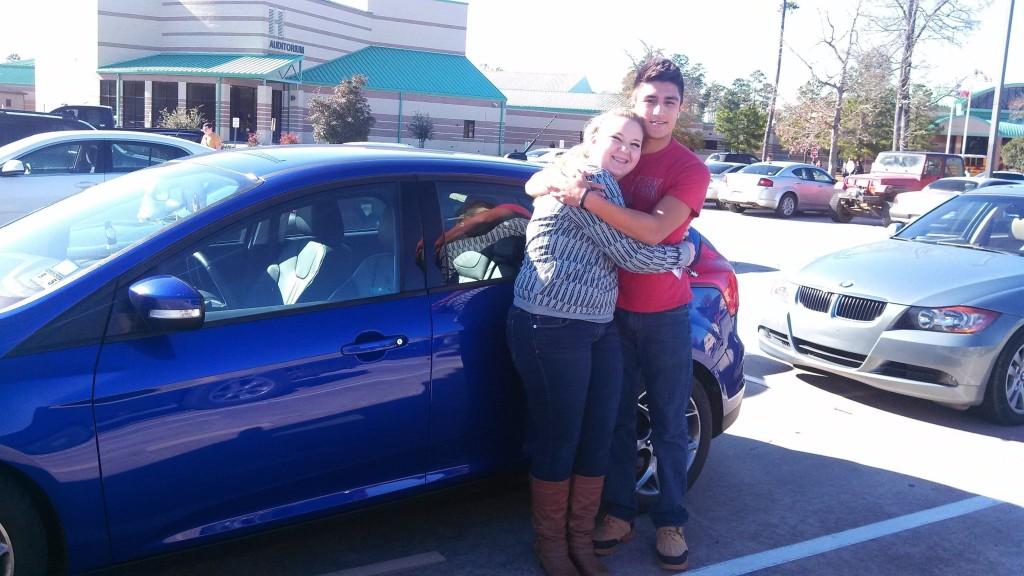 Senior JAckie Bracewll shows off her own car with her friend, Corbin Rios