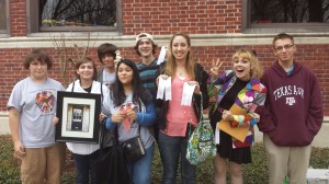 German club participants showing off their awards and projects.