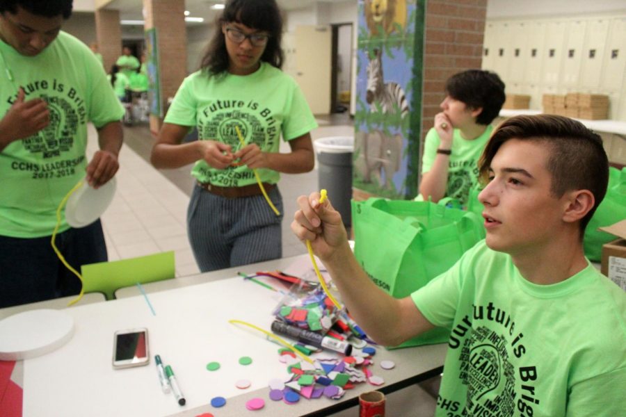 Freshman Julian Mendez, right, works with other student leaders on a project at the leadership conference.