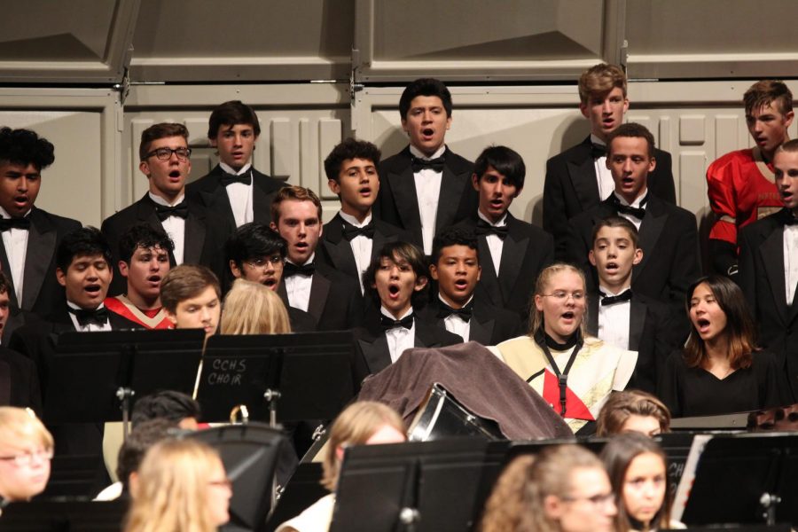 The+choir+performs+at+Caney+Creek+High+Schools+auditorium+during+its+Nov.+8%2C+2018+winter+concert.