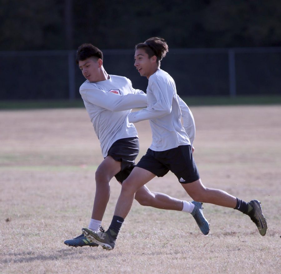 1V1. Sophomores Oscar Salmeron and Jorge Jaimes compete in a 1V1 drill during soccer tryouts.