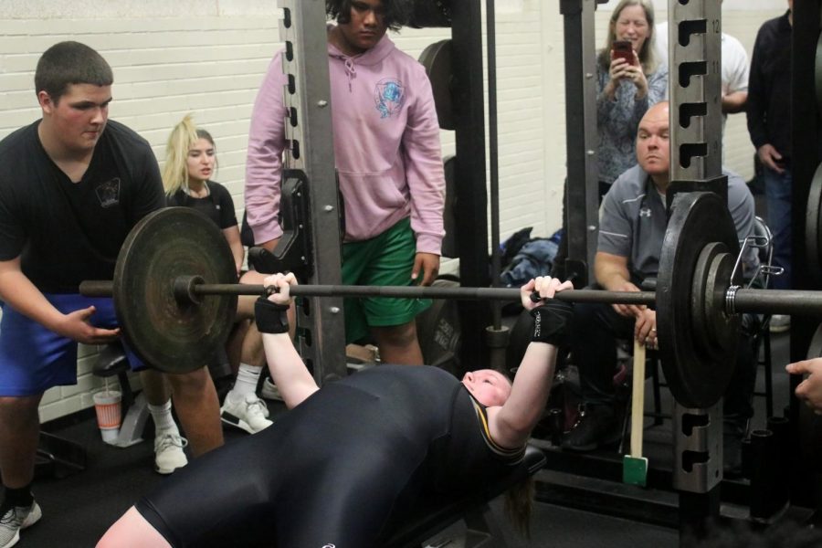 STRENGTH. Junior Realyn Peddy bench pressing 185 lbs at a quad meet held at Conroe High School Jan. 31.