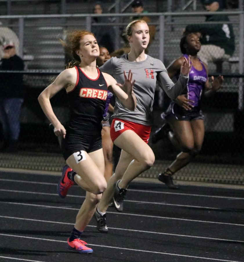 SHORT DISTANCE. Senior Anna Cox runs the 200 meter run at a meet in Hargrave High School. 