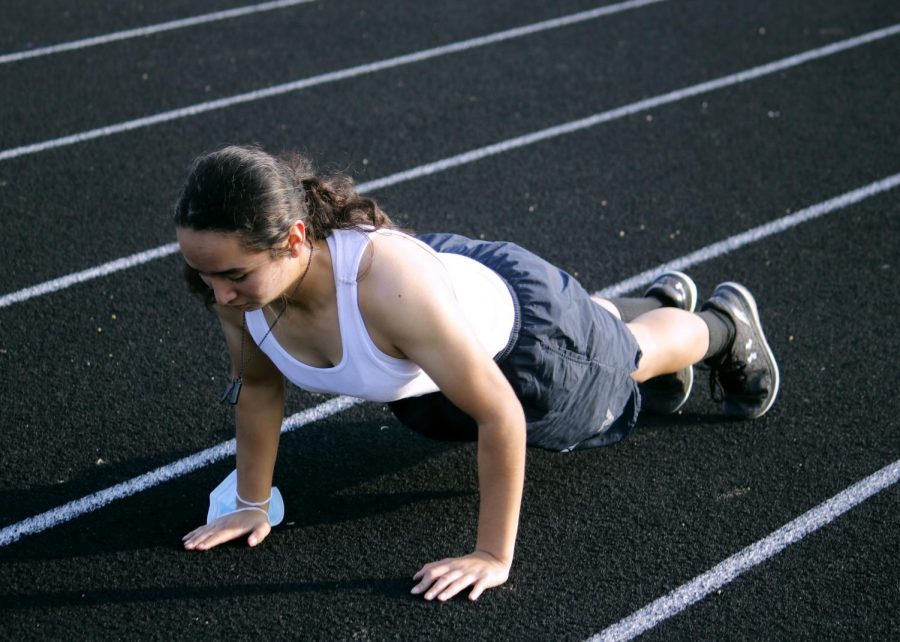 Myra Ortiz is pumped up while doing push-ups. 