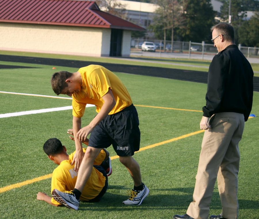 Chief Arms watches Ian Leblanc wrestle around with Jossel Aleman on the field. 