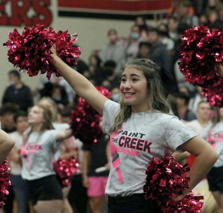 Makenzie Sparta [10] cheers at pink out pep rally.