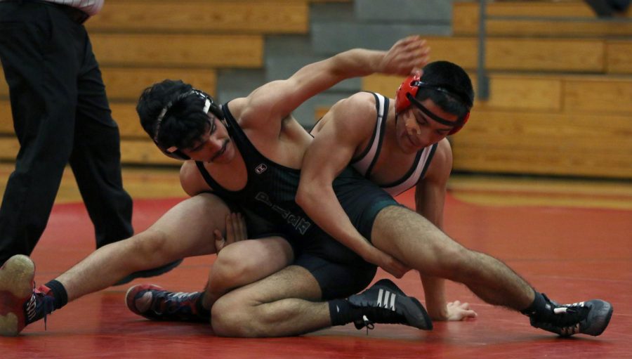Diego Suarez scrambles for a position against opponent..