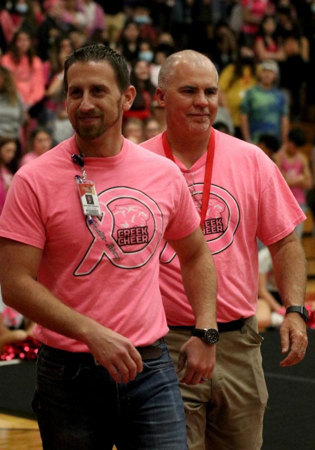 Mr. Moore and Mr. Milam are going forward to get pie thrown at their face for the Pink Out Pep Rally 