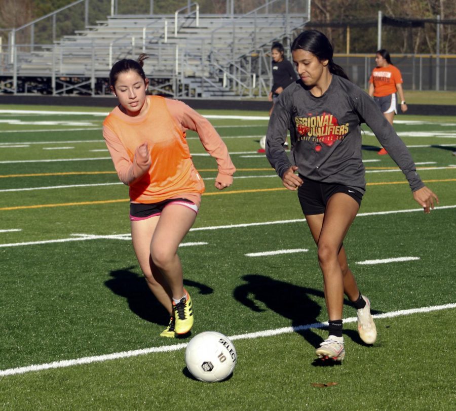 GRAB THE BALL. Lilian Sanchez [11] and Kimberly Flores [12]  going after the ball at the turf afterschool.  Definitely Im gonna do better and its a new year and each year it gets better and Im giving it all of me and giving more to the team and last year we had a chance to go to playoffs and we hope this year also we get that opportunity., said Lilian Sanchez.    