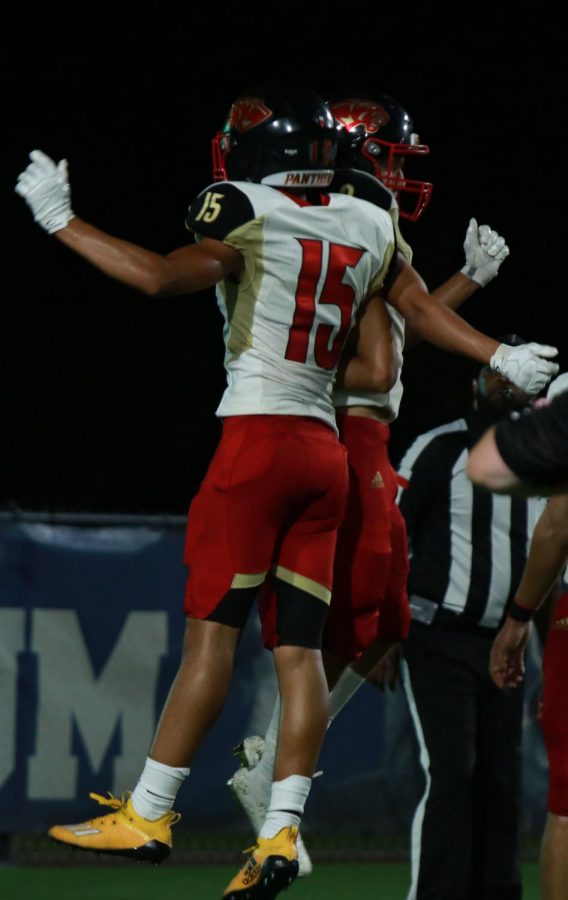 Vidal Garcia (10) celebrates with his teammate who made a touchdown.