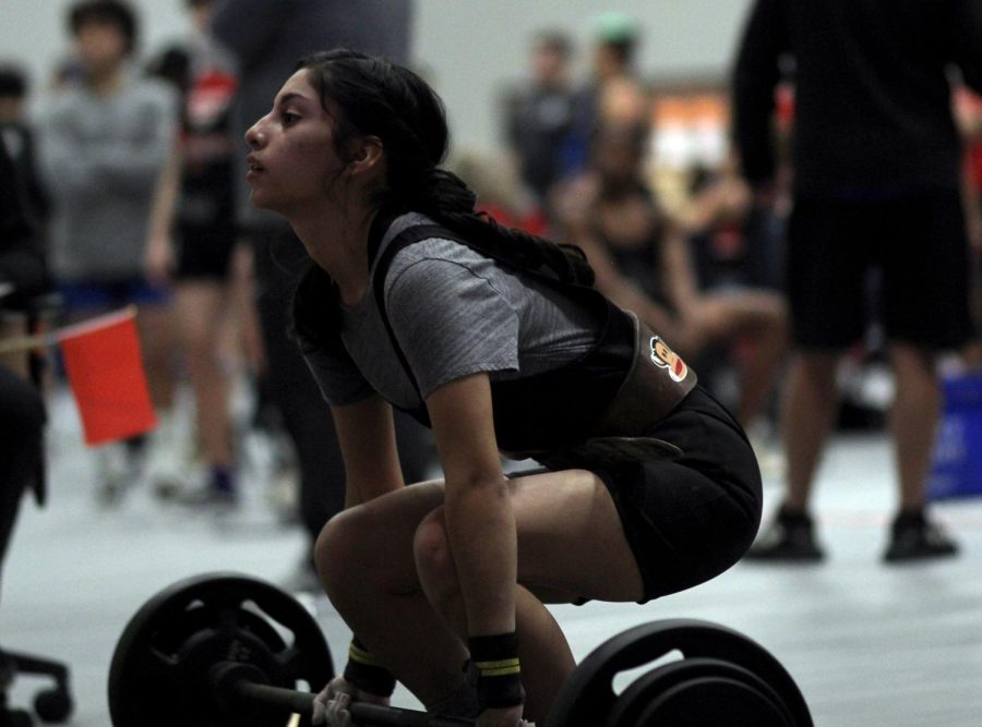 NEW COMER, junior Ruby Sanchez,finishes the final round of deadlift. Being her first year and first meet on powerlifting her weights were lower than she intended.Throughout the whole day receiving support from all her teammates, she was able to push through and place 2nd in the 105 weight class.
