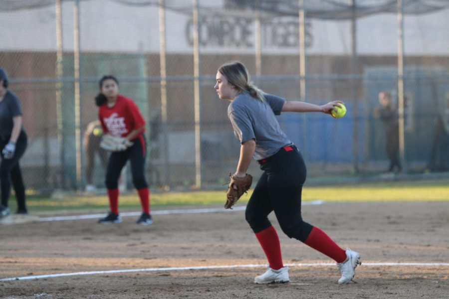 Alexis Johnson pitching her first game of the new season. " The first pitch I took I was scared of hitting one of the girls but I knew I was going to be ok once I talked it over with my team" Alexis said.