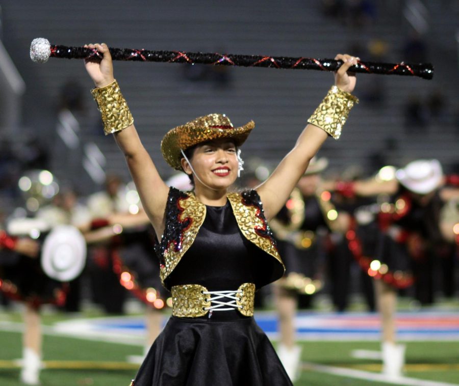 Ashley Torres [12], Starlette Officer, performing during halftime football game against Galena Park. 