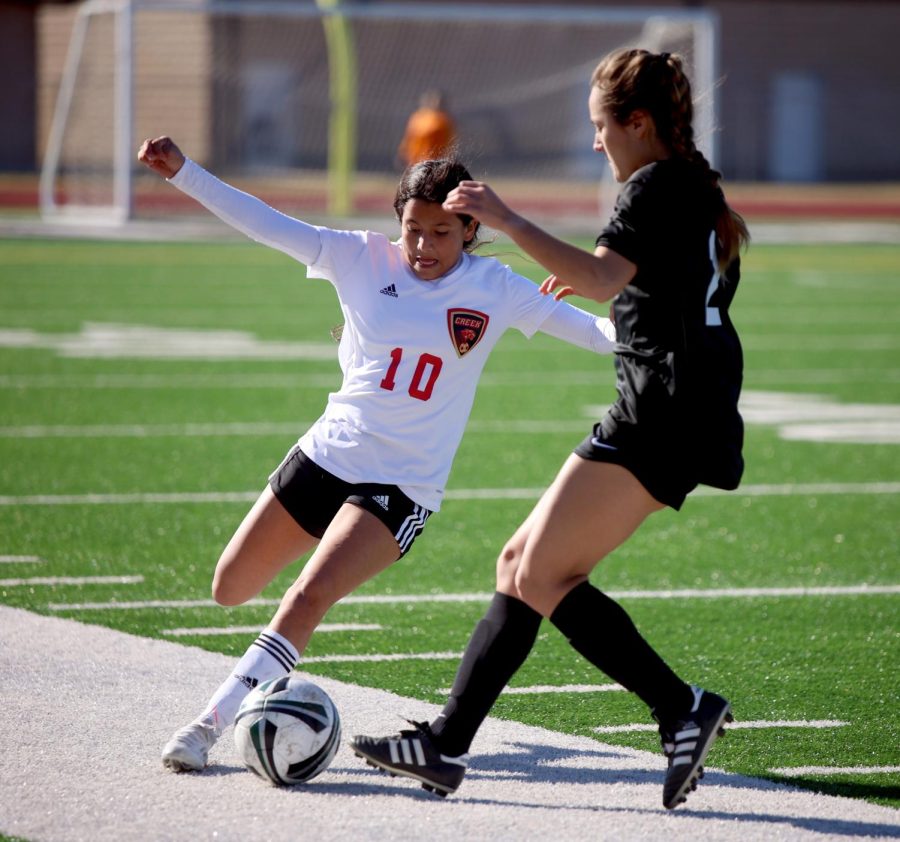 Freshman Elizabeth Sanchez attempts to gain control of the ball against Kingwood Parks player in a file photo from March 2022. Well, I have learned a lot of things about soccer like my dribbling, my shooting everything has gotten way better. The people on the team, I love the people on the team theyre so nice like I love them. It was a really good season, had really good games, we lost some games, but we won some games, we did really really good on them and I am proud of where the team has come, said Elizabeth Sanchez. 