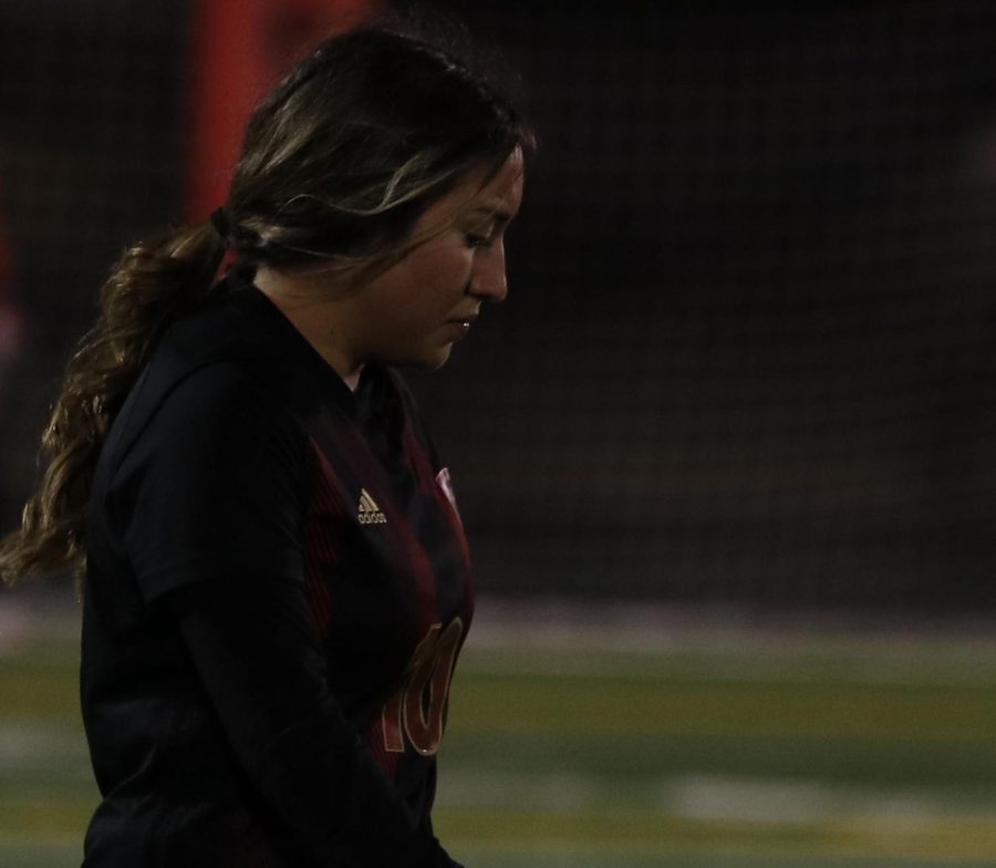Berenice Lopez (11) takes a moment after getting hurt playing against Montgomery 