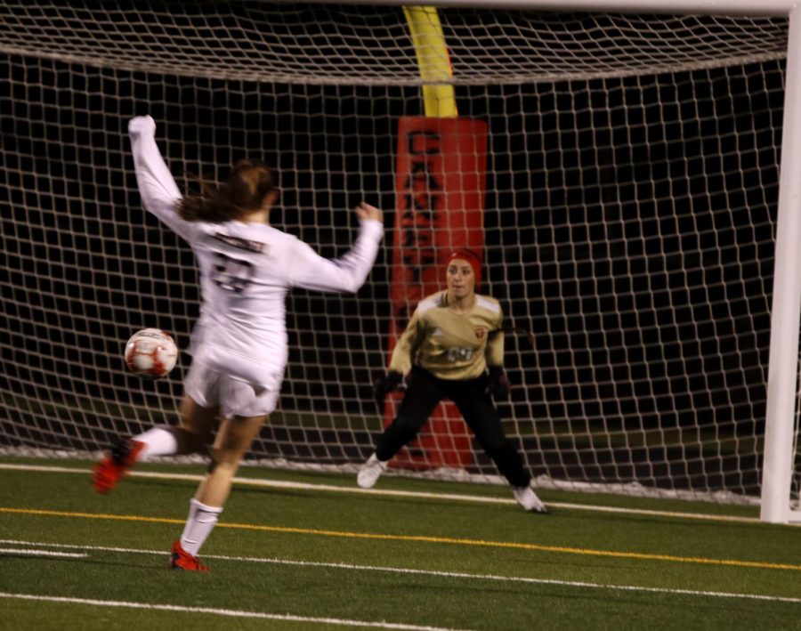 Shay Musachio (12) caught the ball after Montgomery shoots at her.