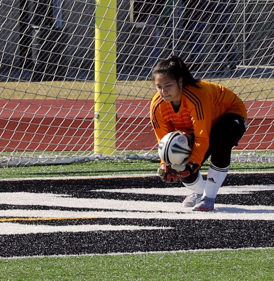 Gisela Perez (11) stops the ball and saves it. 