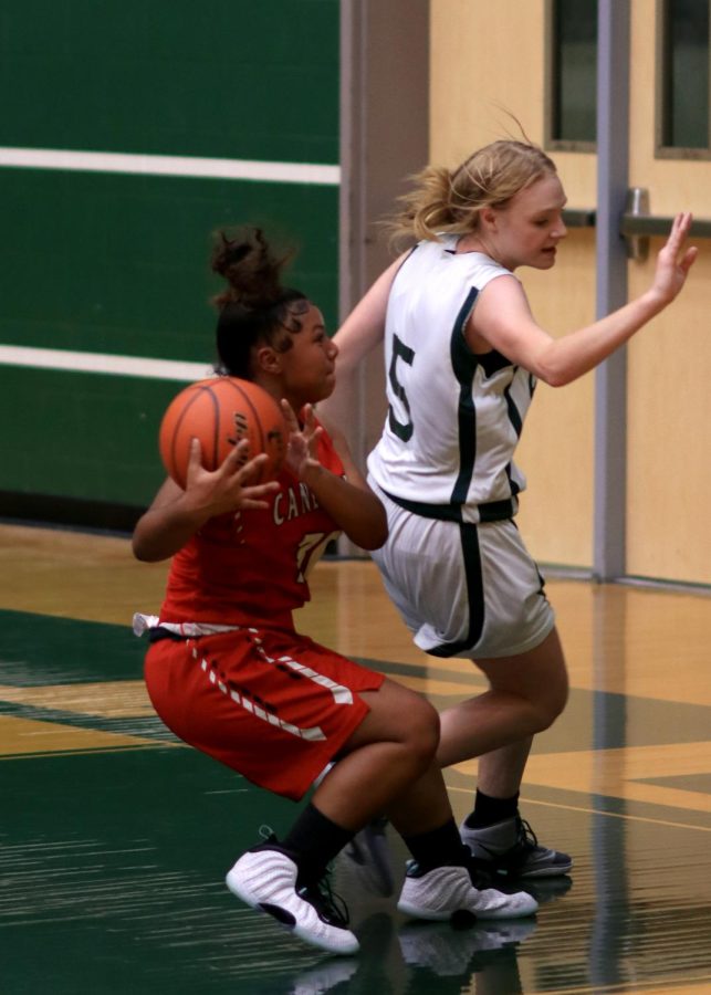 Freshman Malayah Carter stoping to shoot a layup against New Caney.