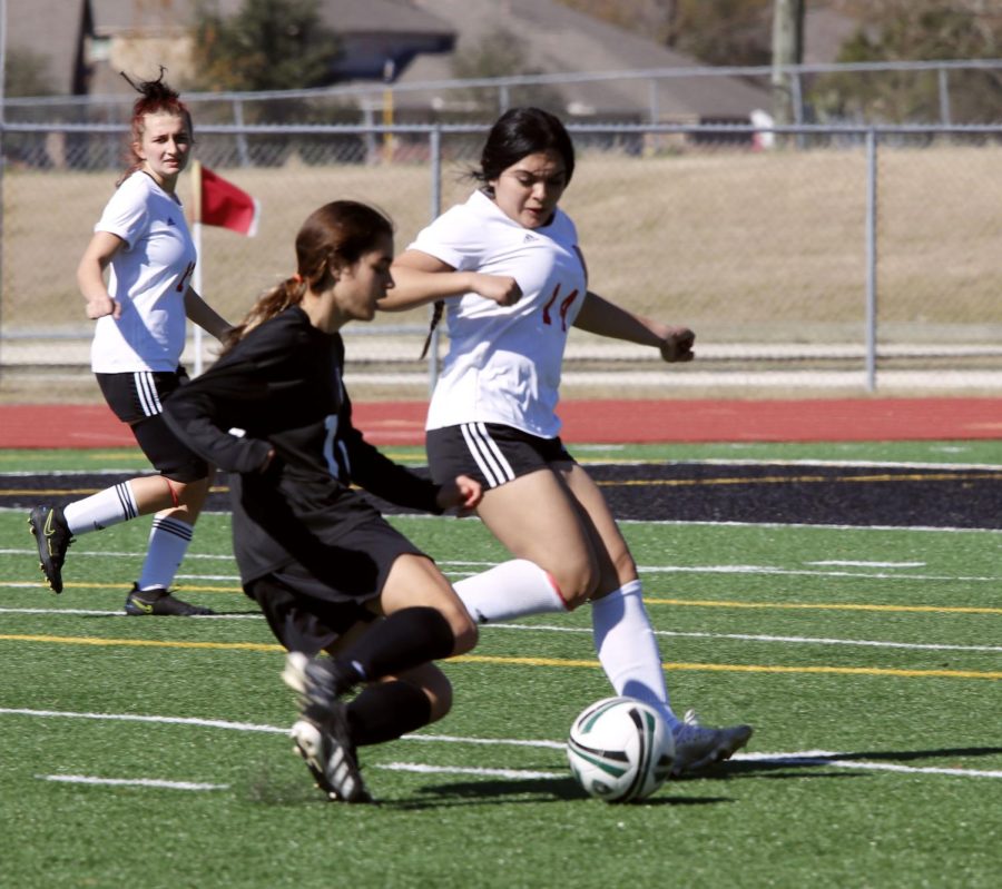 Arleth Garcia (11) defense, and fights to get the ball back.