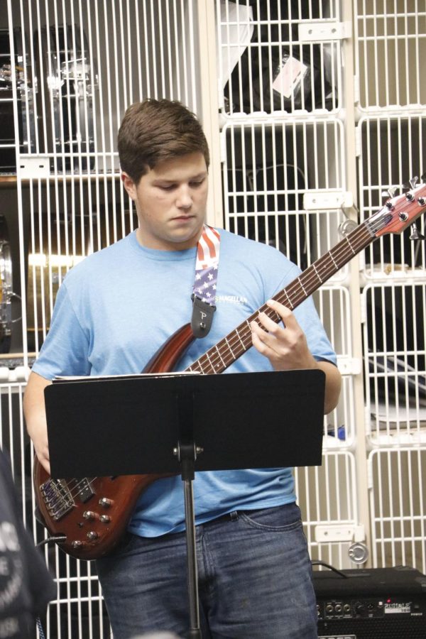Brent Humberson playing the bass and having a very fun time with it " This was my first time playing it but I think I did a good job" Brent said.