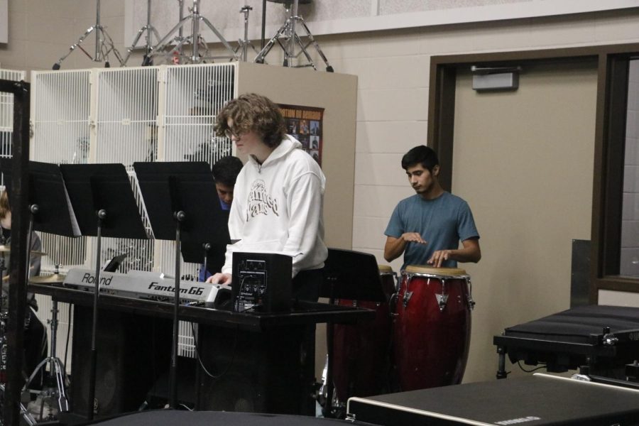 Drum line working hard in the back and making the whole thing come together 