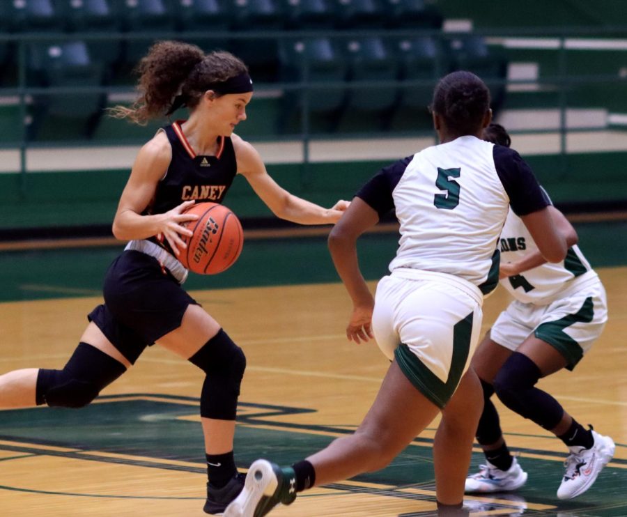 Varsity player Hannah Foster (12) drives against Livingston.