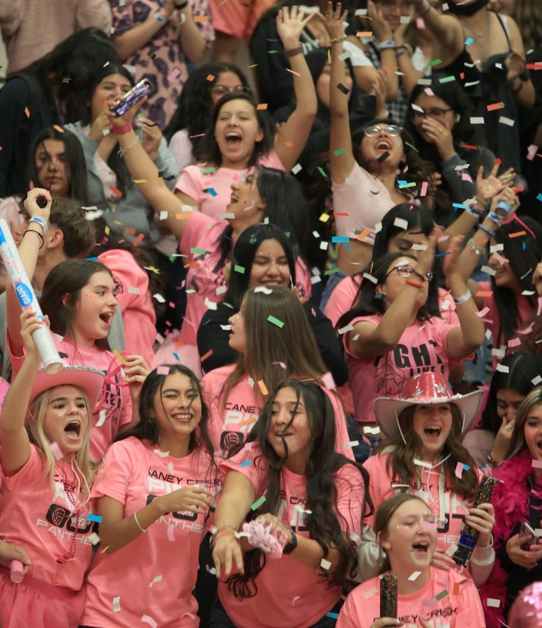 CHEER ON. Sophomores Jaylin Burgess, Hailey Barker, Kaylee Woodly and others all cheer as loud as they can to get the spirit stick at the pink out pep rally on October 14, 2022. 
