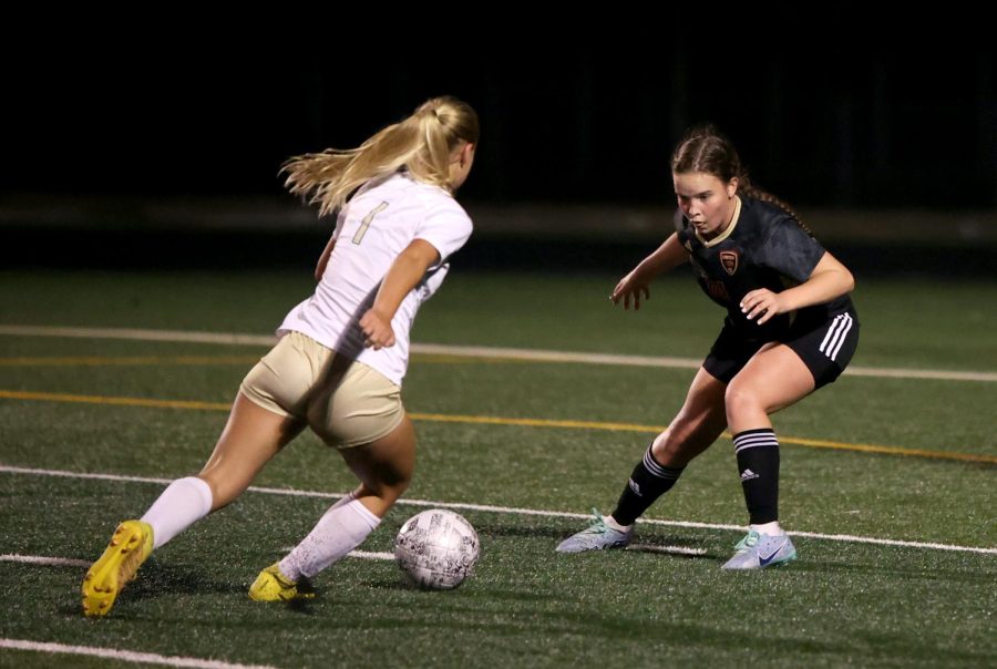 NEXT TIME. Junior Jordan Jahn defends center forward from Conroe on Jan.17, 2023 at home. During the game Jahn felt the team working as hard as ever, though they lost, she feels it’ll set them up for next time. “I feel this was one of those games where the scoreboard doesn’t tell the whole story,” said Jahn.