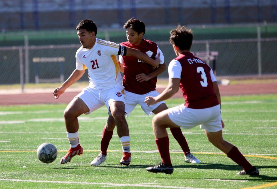 Junior Mario Leon Portillo makes the attempt to find a way around 3 Cy-Fair defensive players on Jan,14. 2023 at Kingwood’s Soccer Stadium. Varsity was on a 4 win streak, and went on to win 3-1 against Cy-Fair making it their 5th win in a row. “I was concentrating on holding the ball long enough to buy time for my teammate to check in for the pass so we could move up and attack.” Portillo said “Winning is always a good feeling especially when we win 5 games in a row.”
