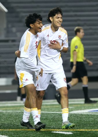 HALFWAY THERE. Junior Asaf Flores and Emmanuel Gloria both celebrate at the end of the first half after Emmanuel Gloria scored a goal in favor of his team on Jan. 17, 2023 at Moorhead Stadium. “I felt amazing, I felt hyped playing against our rivals, they had nothing on us.” Flores said “It was my first 6a game playing with varsity and scoring on the first game was such an unexplainable feeling.” Gloria said.