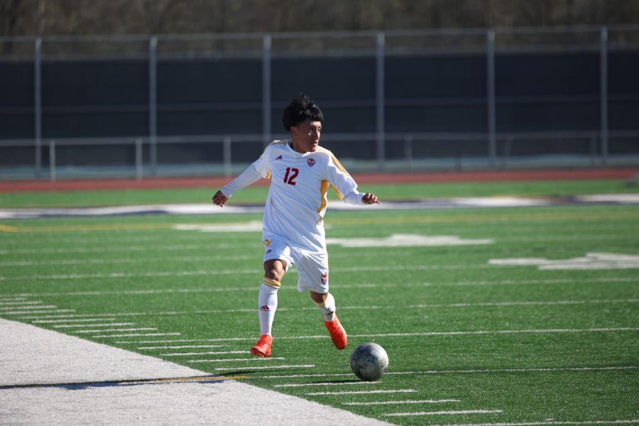 DRIBBLE. Junior Erick Chavelas dribbles the ball down to go score on Jan.14 , 2023. They  went to score. 