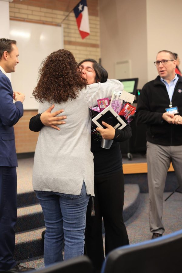 World history teacher Karen Solberg hugs senior Alinne Flores after both were presented the Conroe ISD Ambassador Award on Monday, Jan. 30.