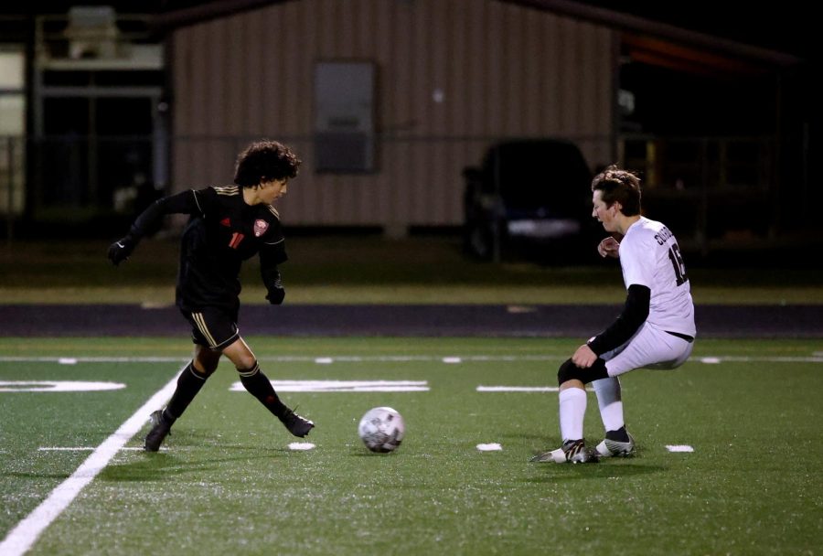 CLEAN PASS. Junior Varsity Player, Alexis Cruz, steps upfield to be in enemy territory against Conroe high on February 16th. Alexis was playing the second game against Conroe high to fight for second place in district, “It was round 2 and I just knew we couldn’t lose the game so there was no room for any mistakes.”
