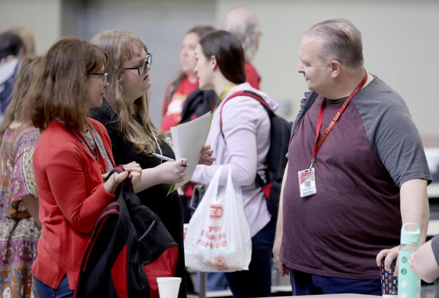 English teachers Todd Nance, Emily Dixon and Stacy Brown talk after a faculty meeting at 9 a.m. Friday, May 5 a day after evacuating the building due to a mysterious odor.