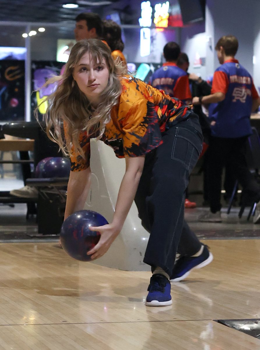 Focus on the pins. Sophomore Abby Cross bowls against Willis on Jan. 25, 2023. She throws her last bowling ball expecting it to be the last one she throws for the season but ends up making it in third place for regionals. I enjoy bowling because me and my brother would come  up here a lot, Cross said. He told me to make it into regionals so I put a lot of work into it and now were going to regionals.