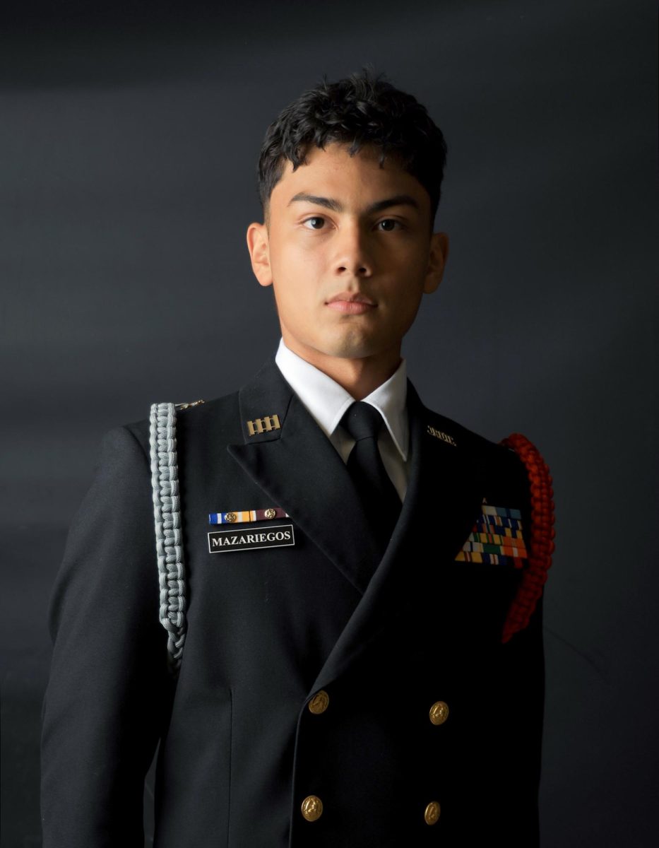CARPE+DIEM.+Senior+Cristian+Mazariegos+takes+his+attention+stand+from+JROTC+to+pose+during+a+magazine+photoshoot+on+Wednesday%2C+Sept.+27.+Over+the+summer+Mazariegos+attended+a+Naval+Academy+seminar+that+gave+him+the+chance+to+grow+his+passion+for+the+navy.+Summer+seminar+is+a+chance+to+know+what+life+is+like+at+campus+where+they+did+physical+training%2C+workouts%2C+and+attended+academic+sessions+according+to+their+majors.+%E2%80%9CHey+if+I%E2%80%99m+good+for+the+Academy%2C+imagine+what+else+I%E2%80%99m+good+enough+for%3F%E2%80%9D+Mazariegos+said.+%E2%80%9CIt+made+me+realize+that+you+really+just+got+to+take+the+risk%2C+take+the+opportunity+and+seize+the+day.%E2%80%9D+%0A