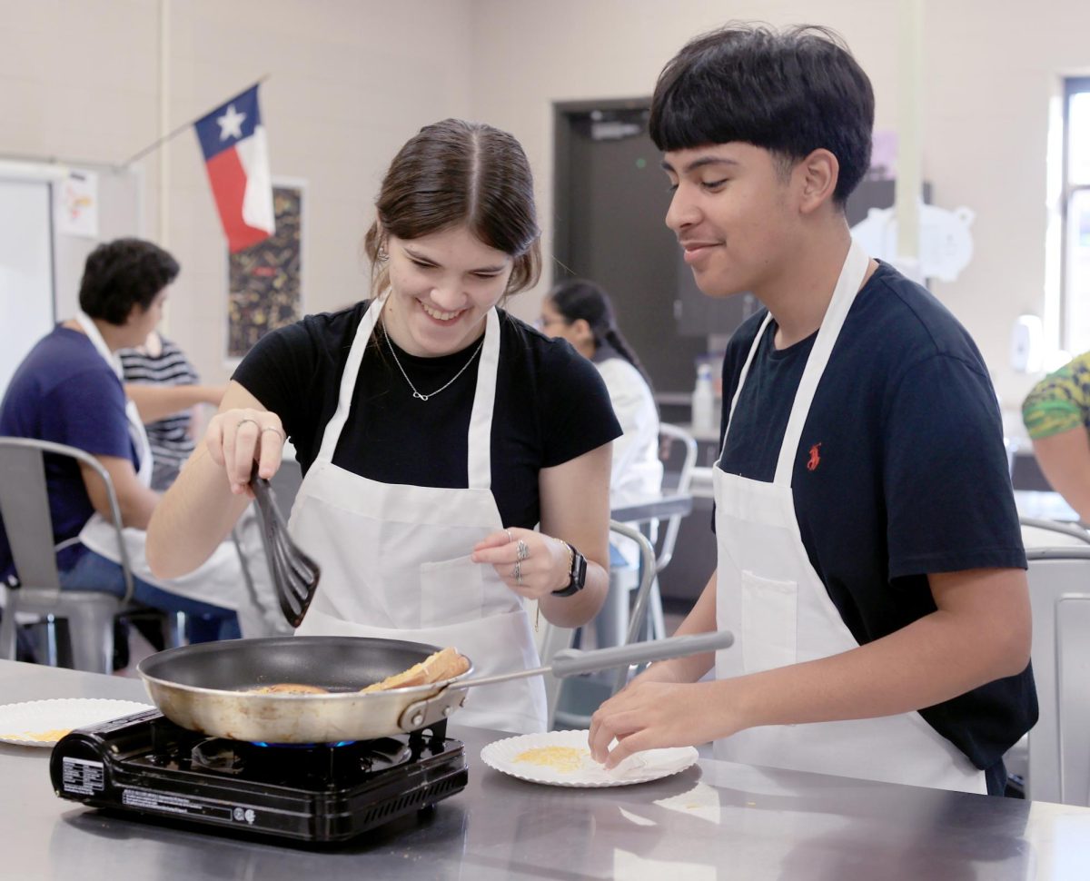 Juniors+Jena+Morris+and+Julio+Mejia++work+together+in+Culinary+class+to+make+a+grilled+cheese+on+Sept.+15%2C+2022.+Students+from+Culinary+always+get+to+try+on+hands+cooking+to+better+help+them+learn+the+art+of+cooking.