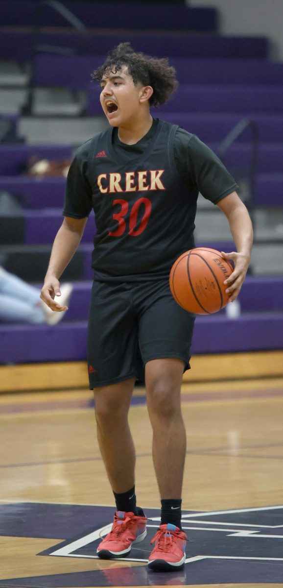 FLOOR GENERAL. Junior Matthew Calderon yells out a play for his team during the  Willis Tournament against Lufkin on Nov. 30, 2023. The team placed 6th at the Willis tournament .“We just came from winning,” Calderon said. “We were losing but man we were supposed to be winning.”