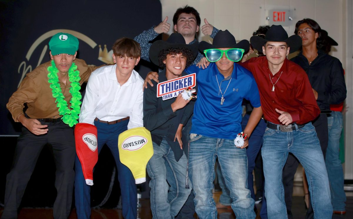 THICKER THAN A SNICKER. Soccer students get together for a mini team photo during the homecoming dance on Saturday, Sept. 16, 2023. This was Sophomore Santiago Arroyo Garcias first homecoming dance, being a foreign exchange student from Spain this gave him the chance to try all new things. His soccer teammates decided it would help them all bond and create new experiences for Arroyo.