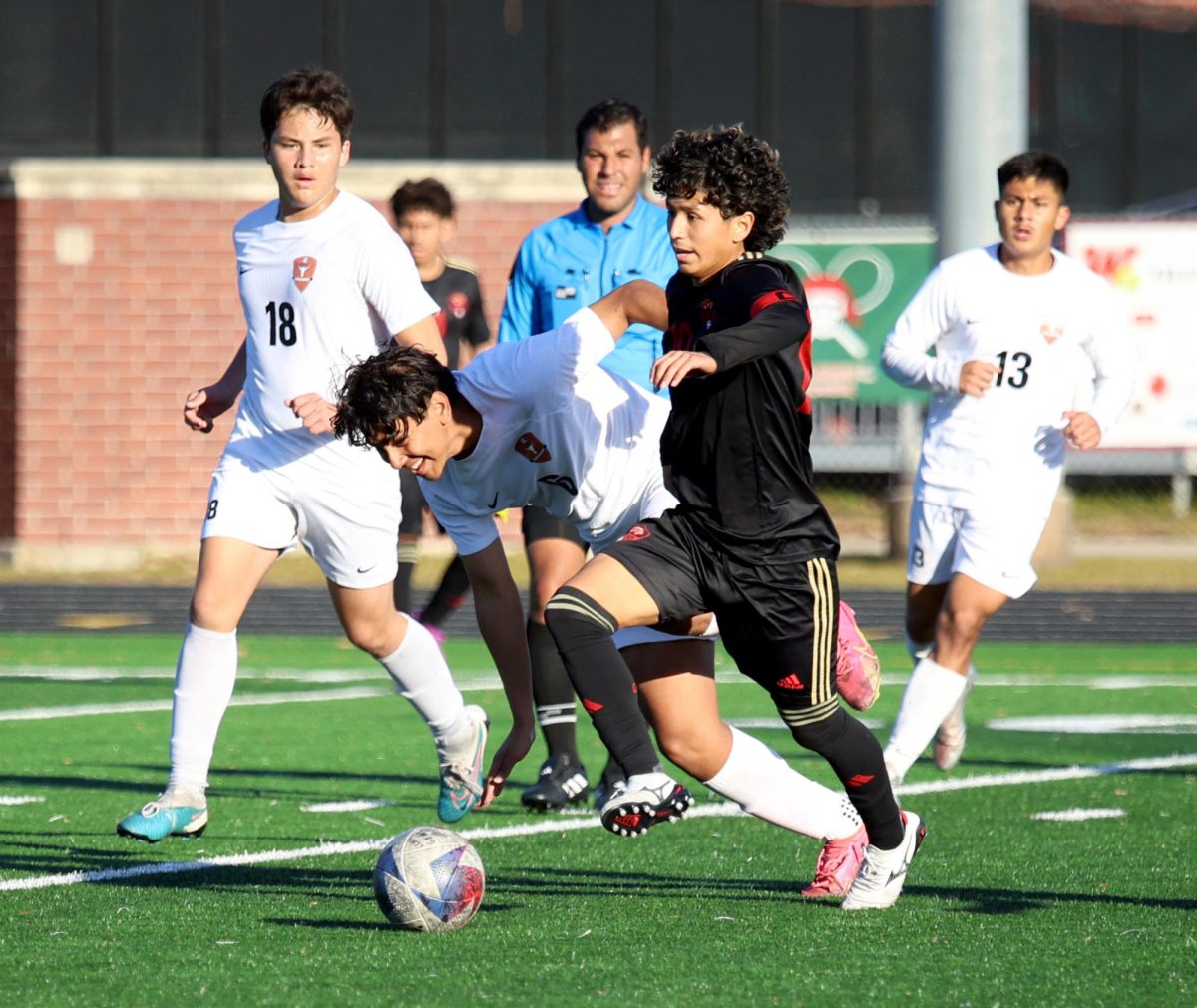 ON YOUR KNEES. Senior Alexis Cruz takes the ball from the opposing team during the Kilt Cup Tournament on Saturday, Jan. 6, 2024. The Varsity team ended the game with a loss of 2-1 against Dobie. “We shouldve won that game, Cruz said. We didnt finish our chances like we should have, but it’s progress and you have to trust it.”
